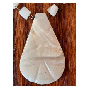 white carved stone pendant necklace